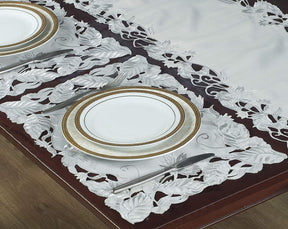 Set of six linen placemats with European embroidery from The Corda Collection, featuring intricate woven patterns.