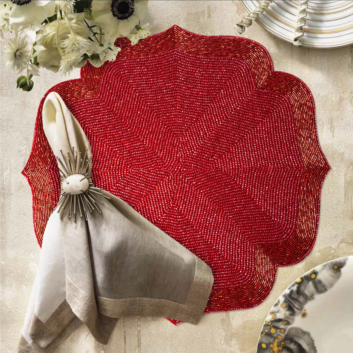 Set of 2 festive embroidered beaded placemats with poinsettia design, perfect for holiday table settings.