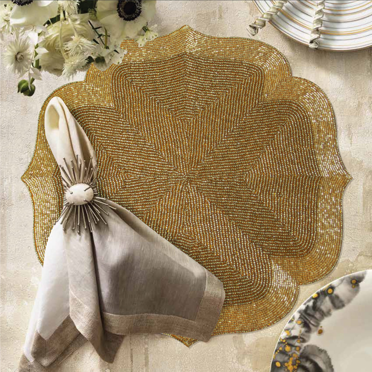 Set of 2 embroidered beaded placemats with festive poinsettia design, featuring intricate beadwork for holiday table decor.