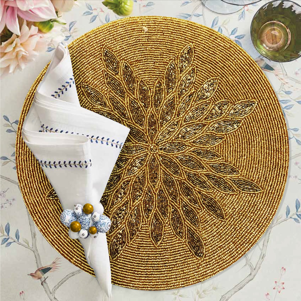 Set of 2 embroidered beaded placemats with festive poinsettia design, ideal for holiday table decor.